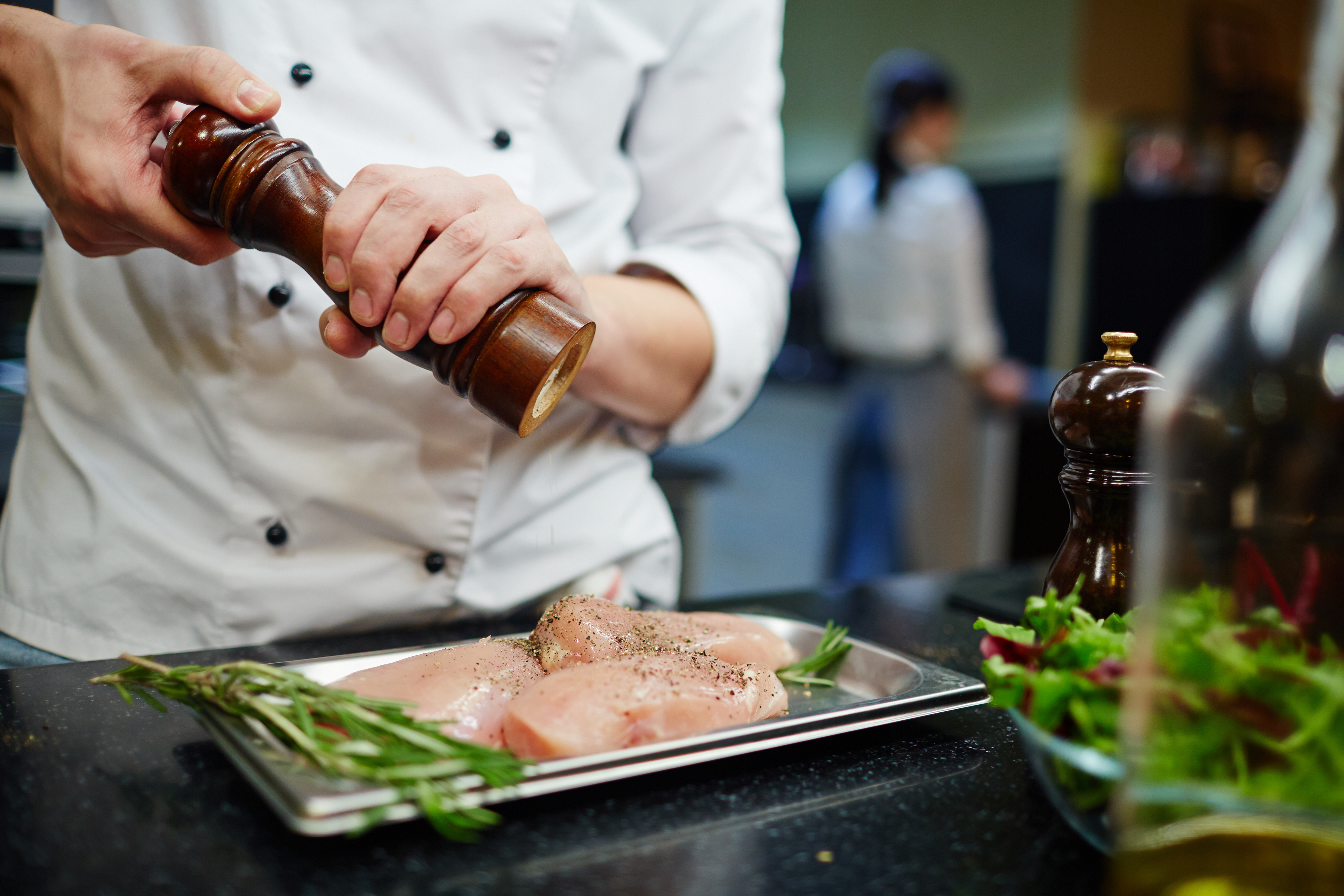 Chief seasoning raw chicken sirloin with aromatic spices
